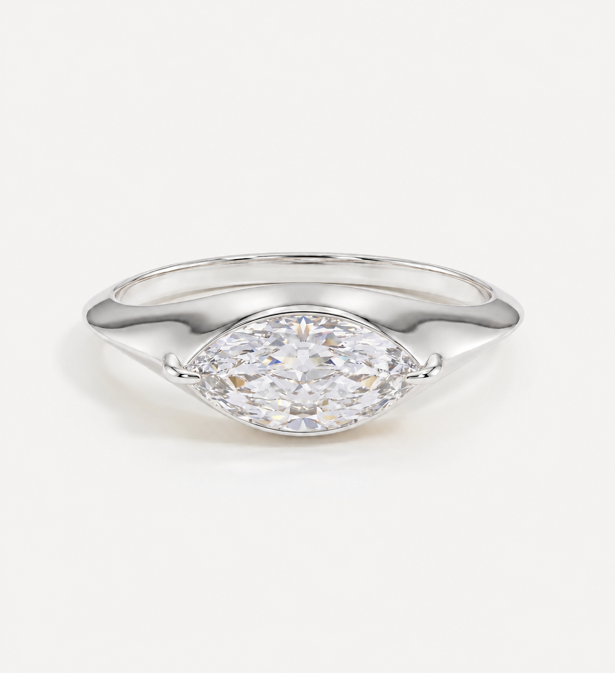 Large 0.50ct marquise diamond solid gold signet ring in yellow gold featuring a bezel-set marquise-cut diamond on a polished signet-style band