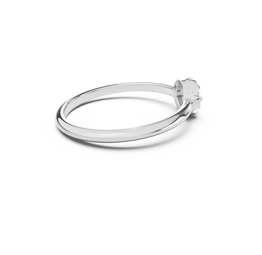 Silver scallop ring with a diamond on a white background