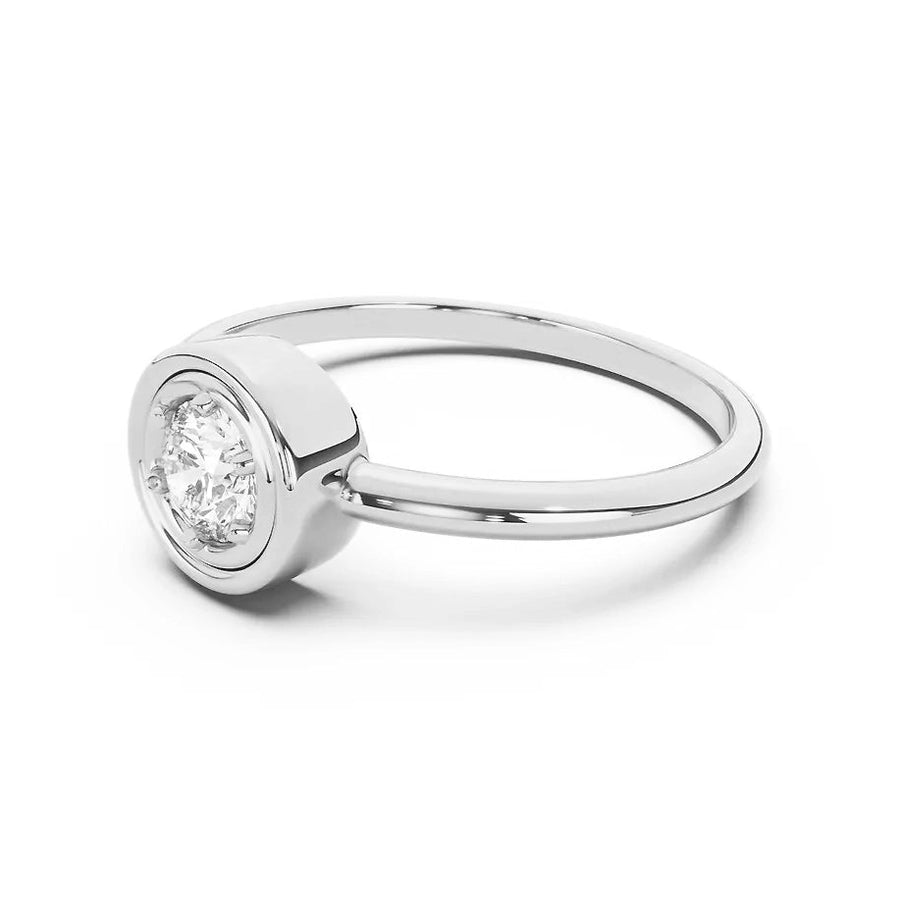 Silver ring with a diamond on a white background