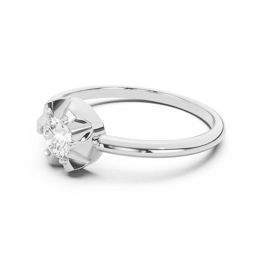 Silver scallop ring with a diamond on a white background
