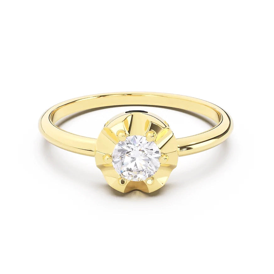 Gold scallop ring with a diamond on a white background