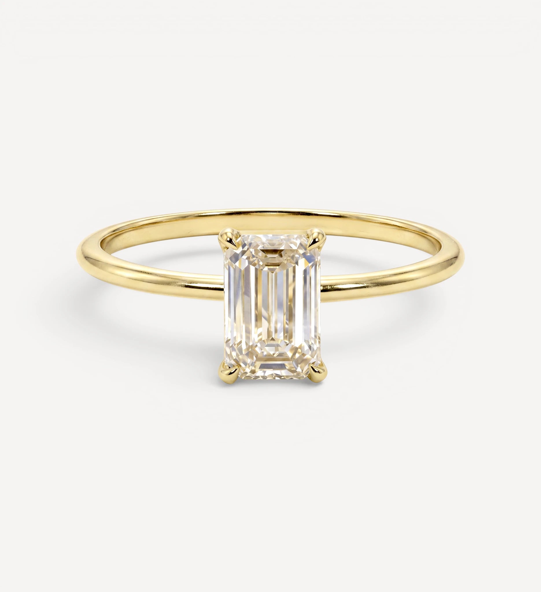 Flora ring | emerald diamond halo