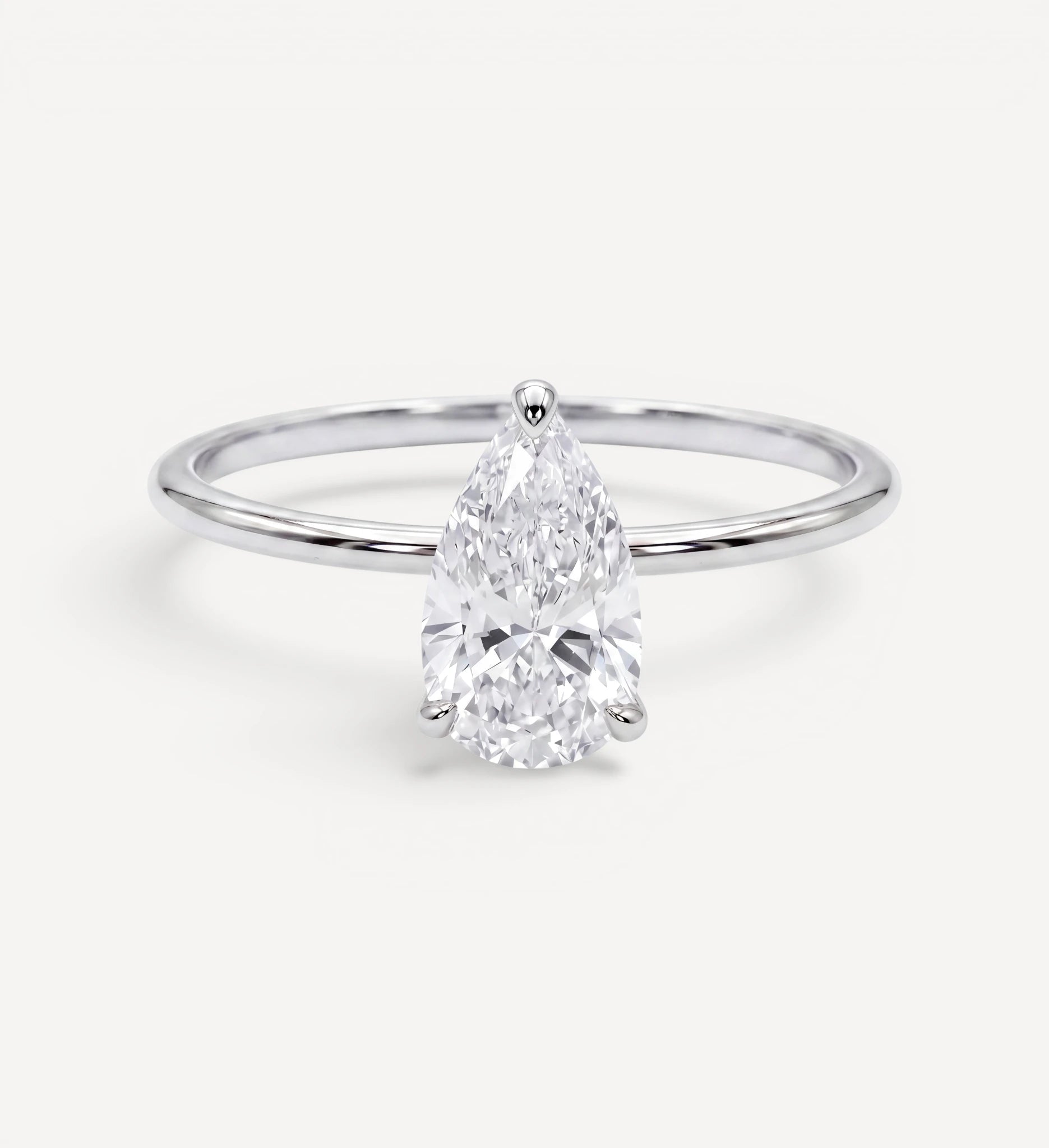 Flora ring | pear diamond halo