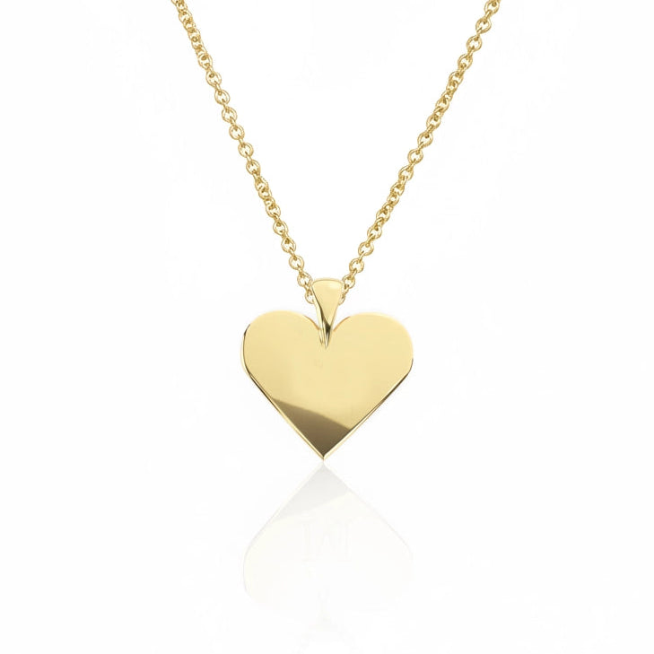 Gold heart-shaped pendant on a chain against a white background