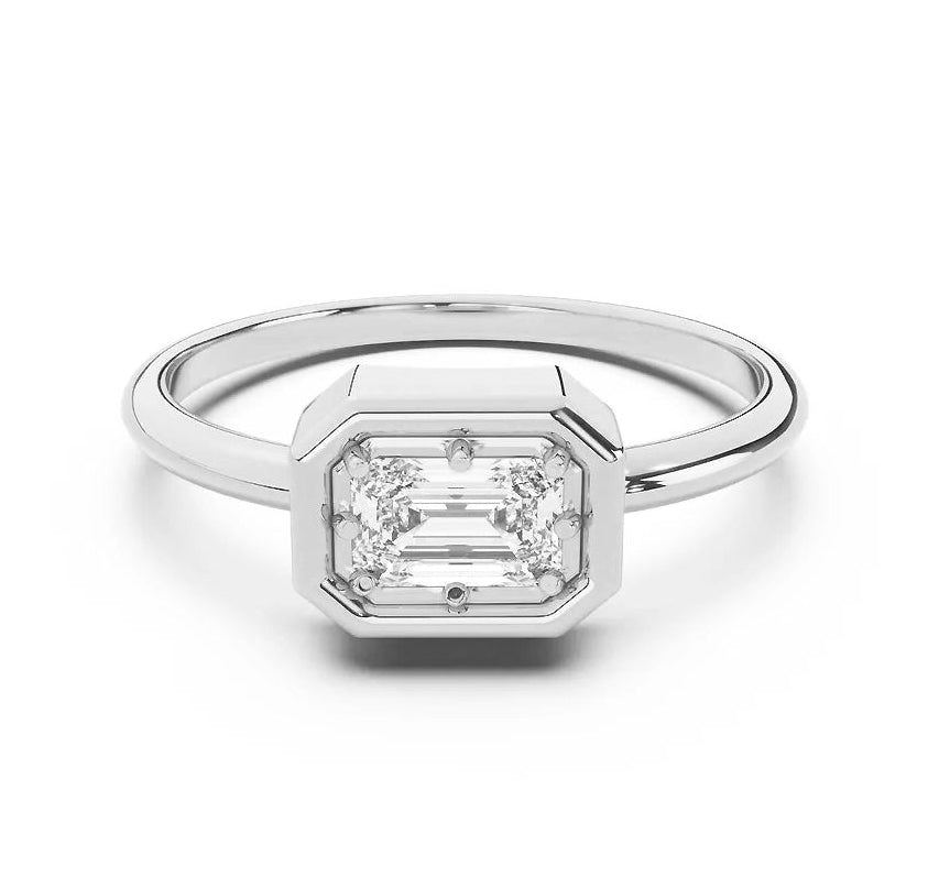 Silver ring with a diamond on a white background