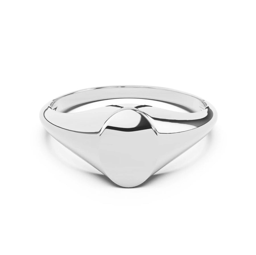 Silver signet ring with a geometric design on a white background