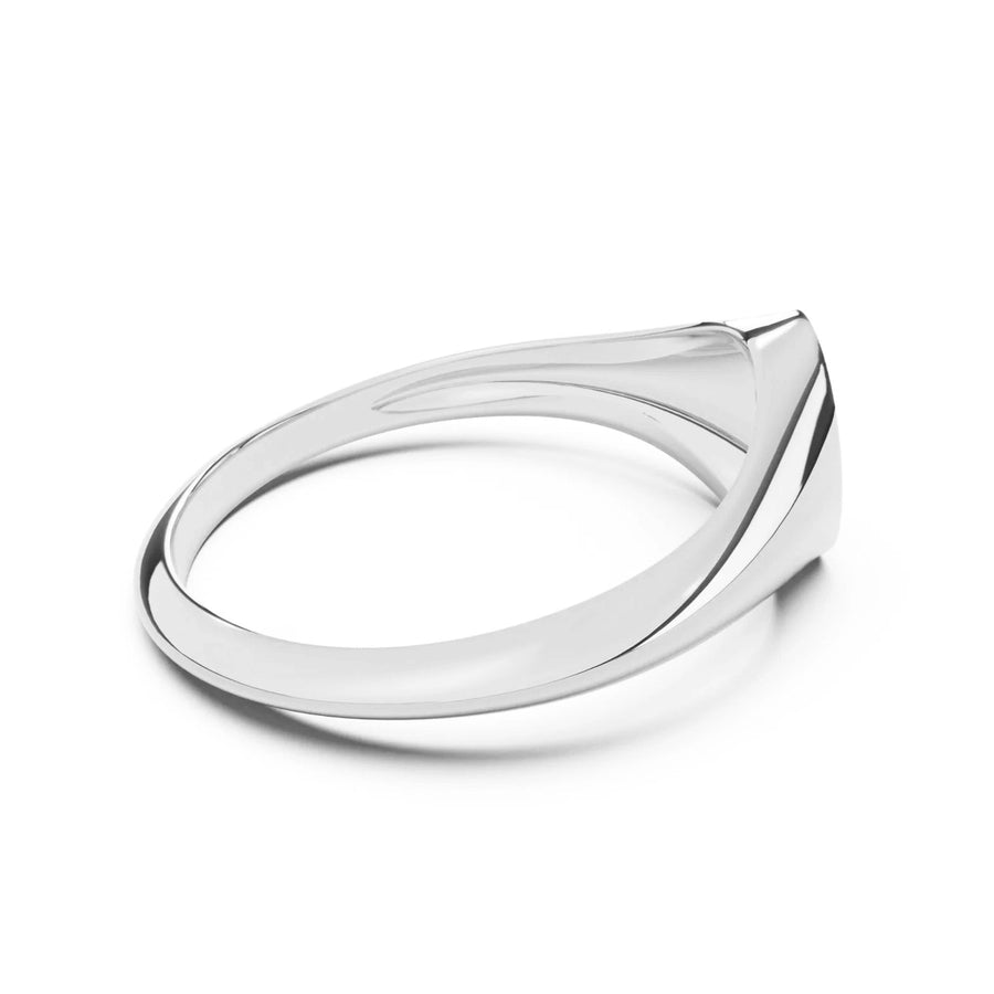 Silver signet ring with a teardrop-shaped design on a white background