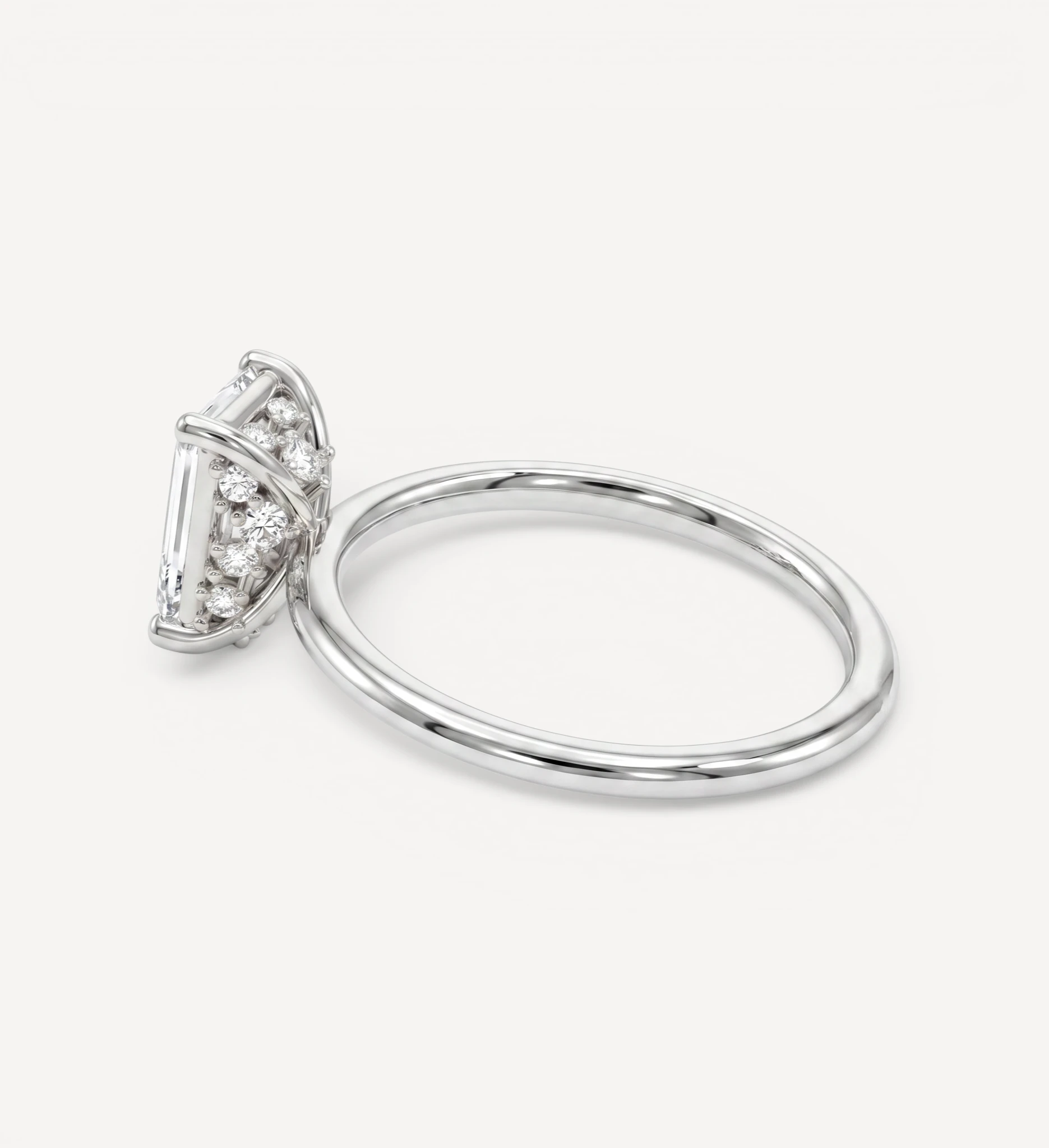 Flora ring | emerald diamond halo