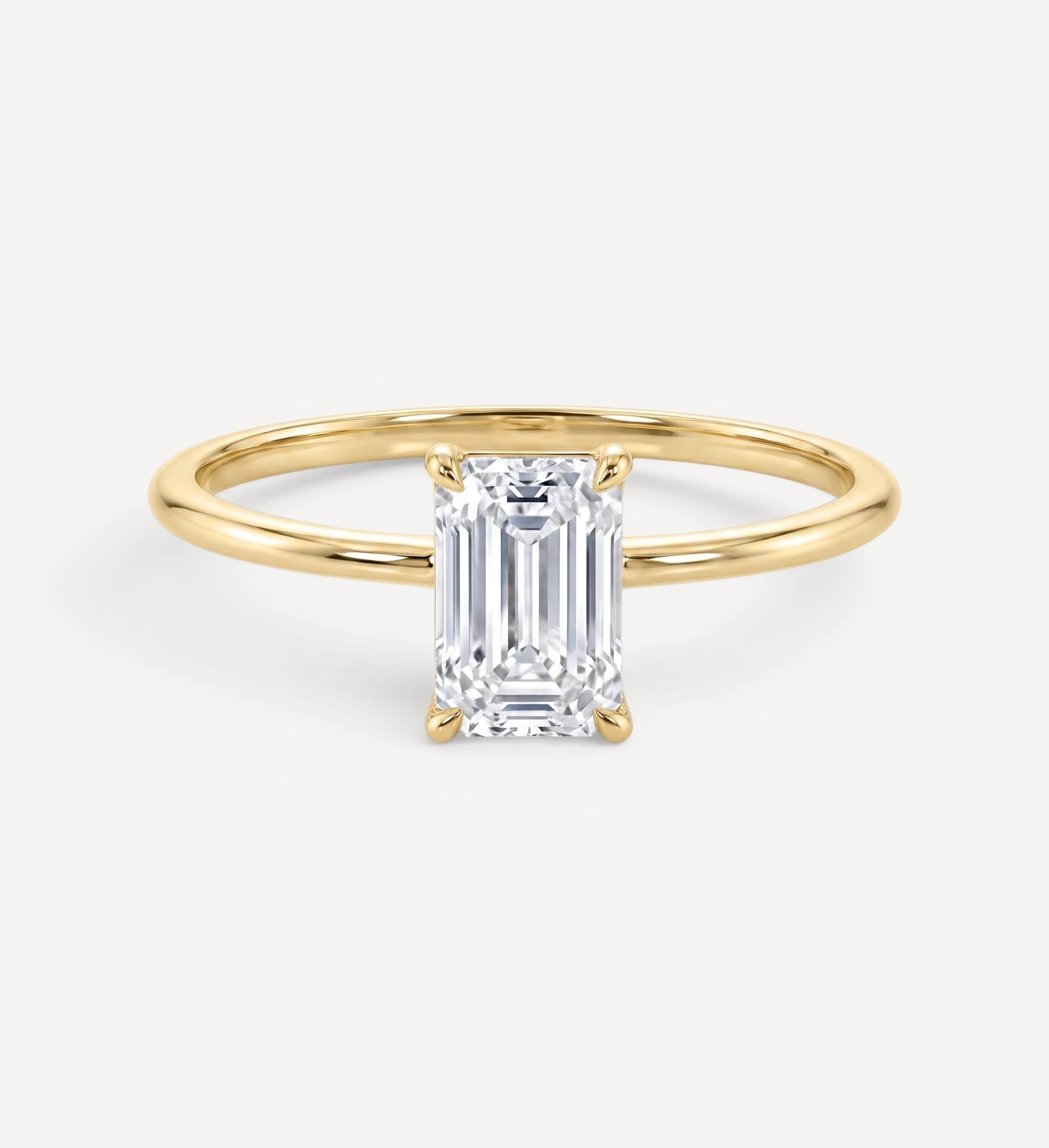 Flora ring | emerald diamond halo