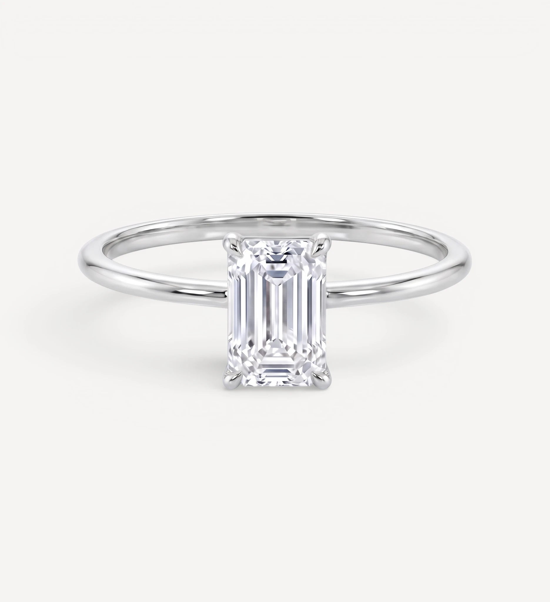 Flora ring | emerald diamond halo