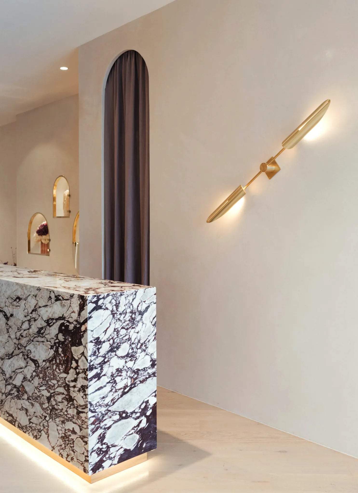 HLSK Jewellery Armadale boutique interior featuring a marble reception desk, bespoke lighting and luxury jewellery showroom in Melbourne.