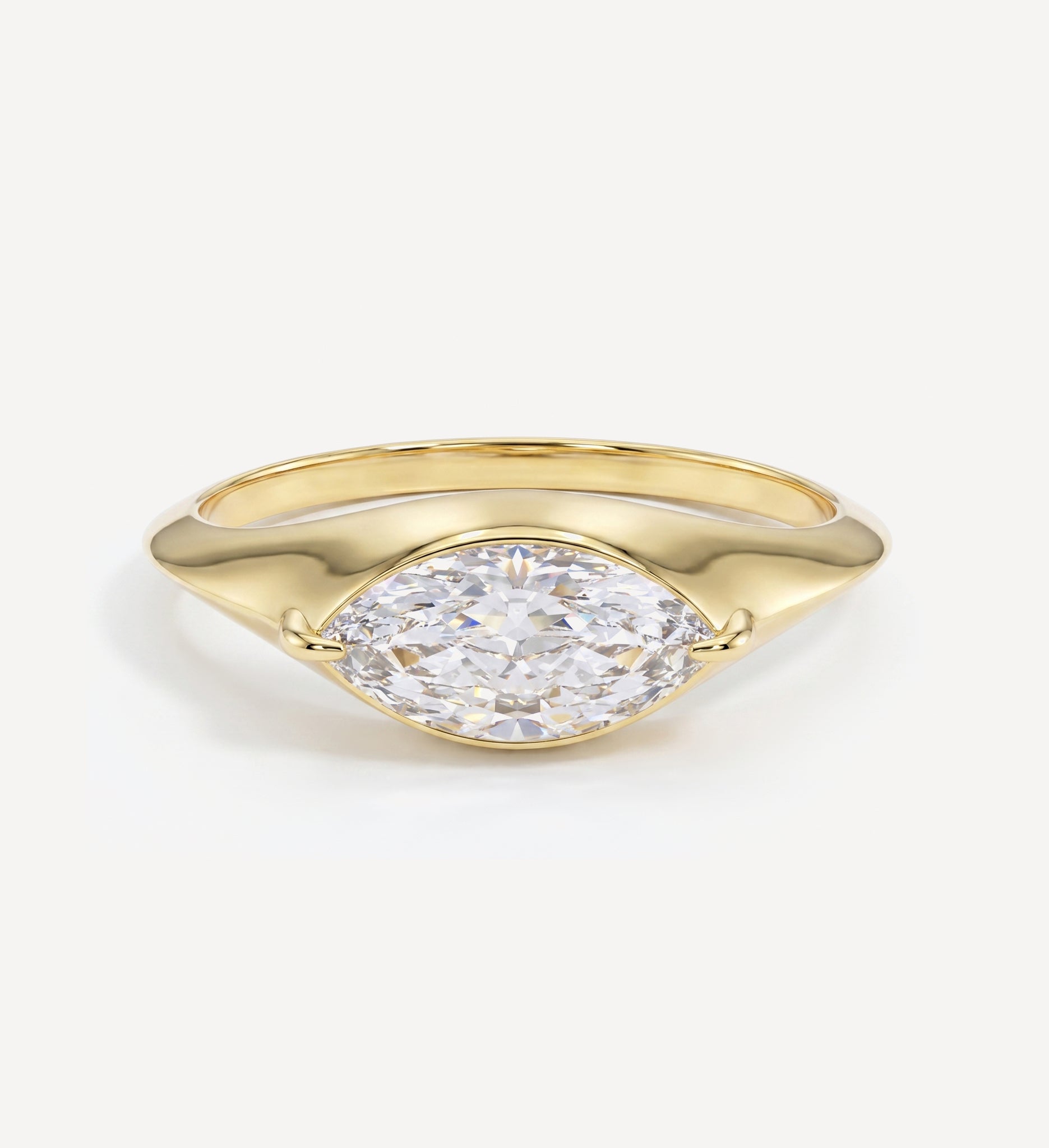 Large 0.50ct marquise diamond solid gold signet ring in yellow gold featuring a bezel-set marquise-cut diamond on a polished signet-style band