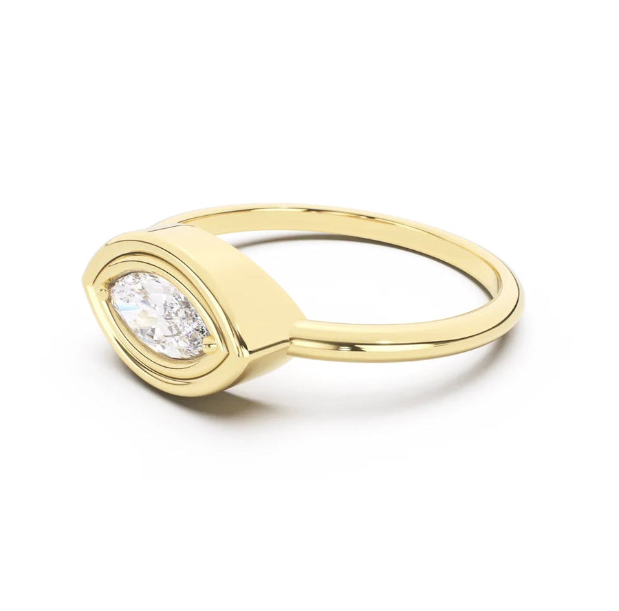 Gold ring with a diamond on a white background