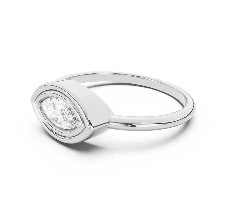 Silver ring with a diamond on a white background