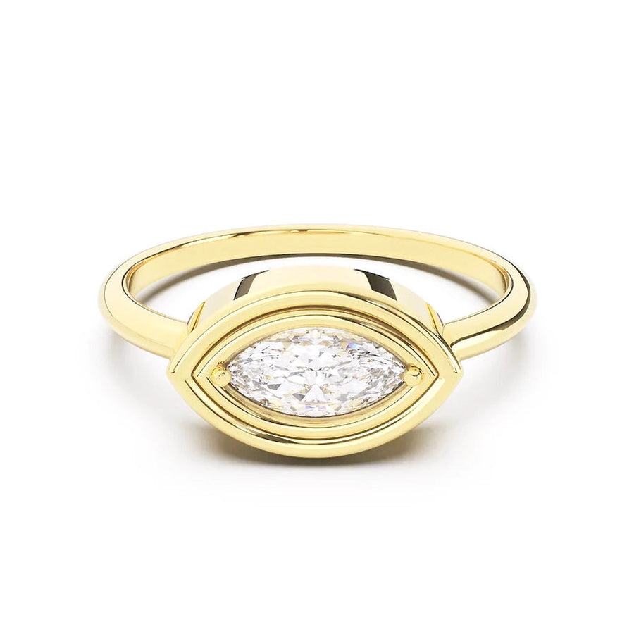 Gold ring with a diamond on a white background