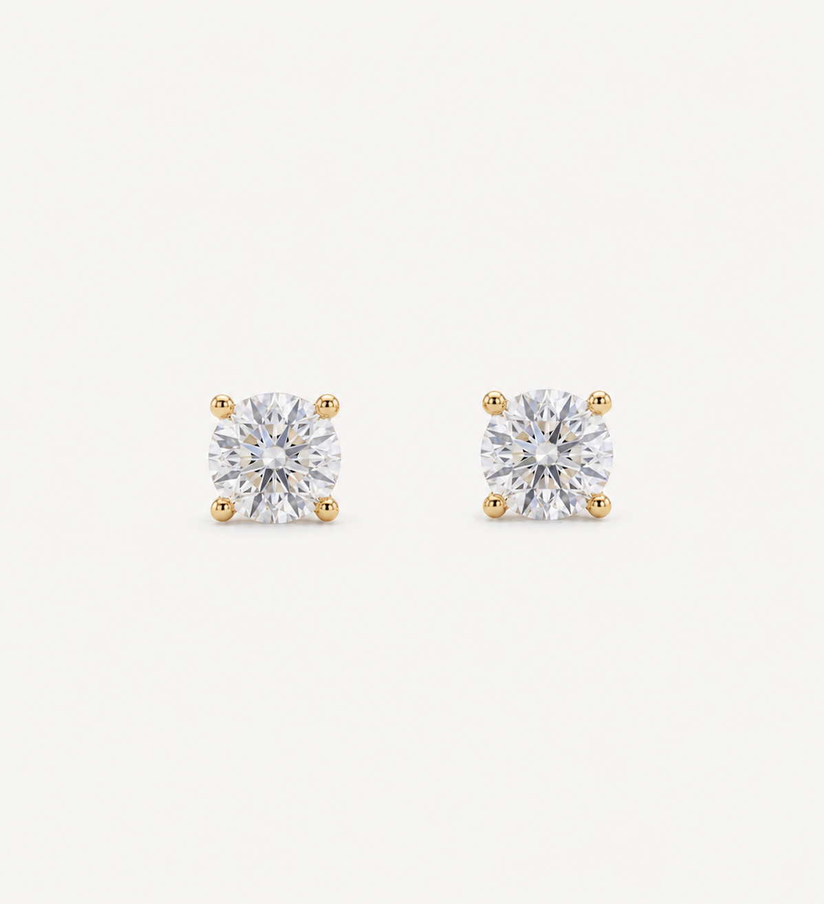 Small Grace round brilliant-cut diamond stud earrings in yellow gold four-prong settings